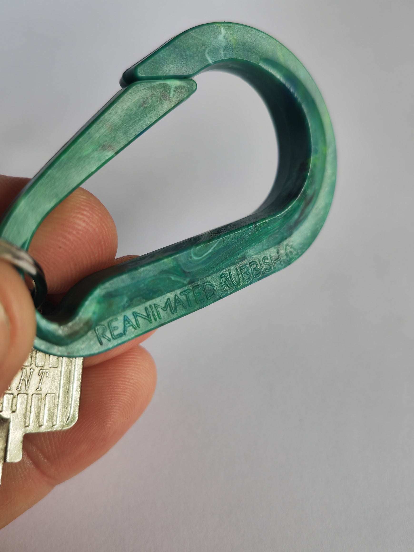 Green and blue recycled plastic carabiner printed with reanimated rubbish